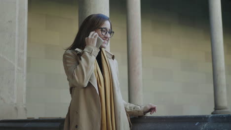 student talking on smartphone in hallway