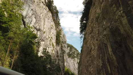 Mountain-gorge-in-Bicaz,-Romania-shot-from-a-car-window-with-the-DJI-Osmo-Pocket