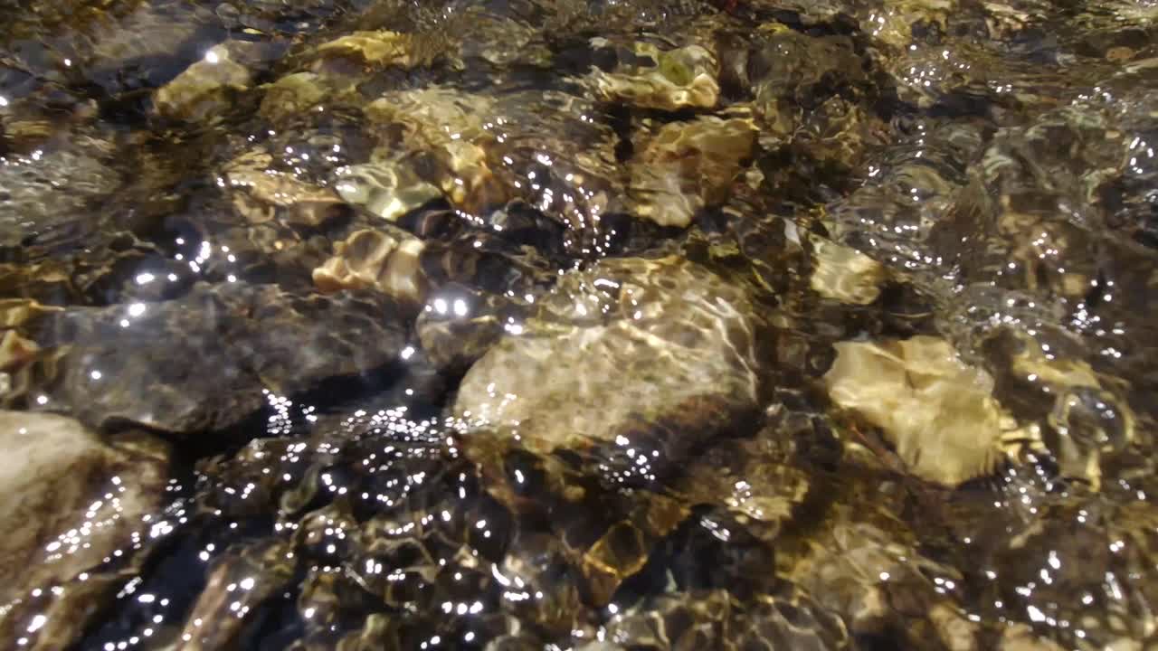 A fast-flowing river flows over rocks.