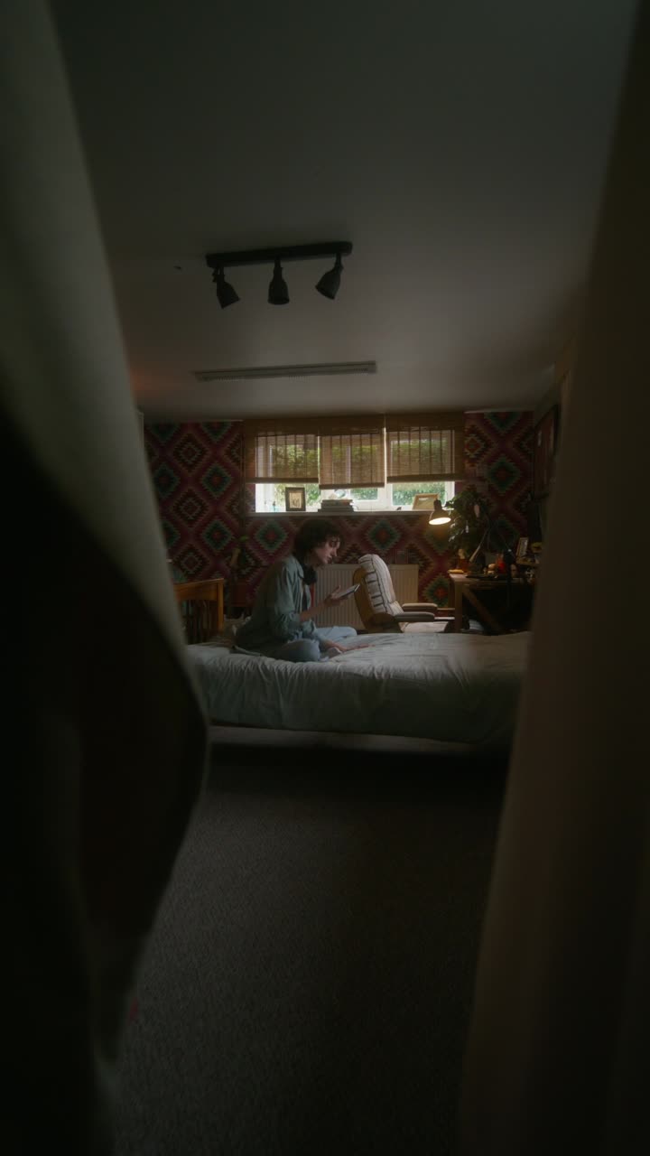 Woman relaxing in a cozy bedroom