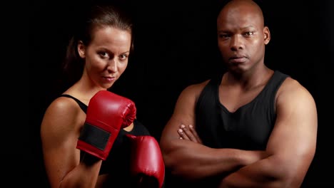 boxer with her instructor posing for camera