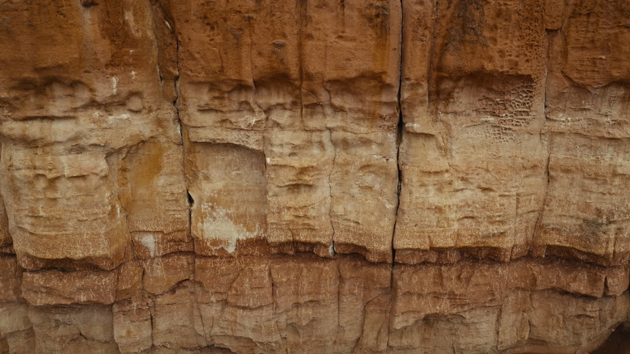 Aerial drone footage of the iconic Chilojo Cliffs in Gonarezhou National Park, Zimbabwe. Cliff close up, details. Dramatic sandstone escarpment rising above the savanna part 6