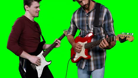 male musicians playing guitar