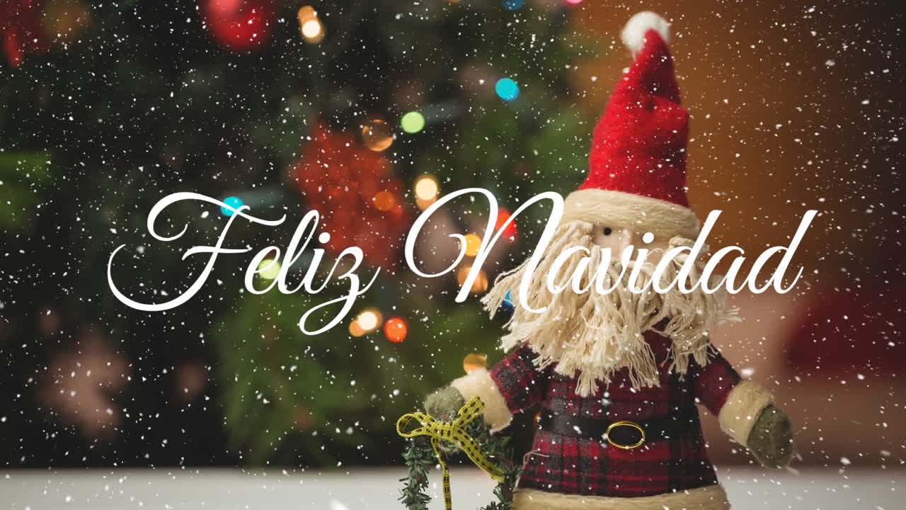 animación del texto de feliz navidad sobre el juguete de navidad de santa claus.