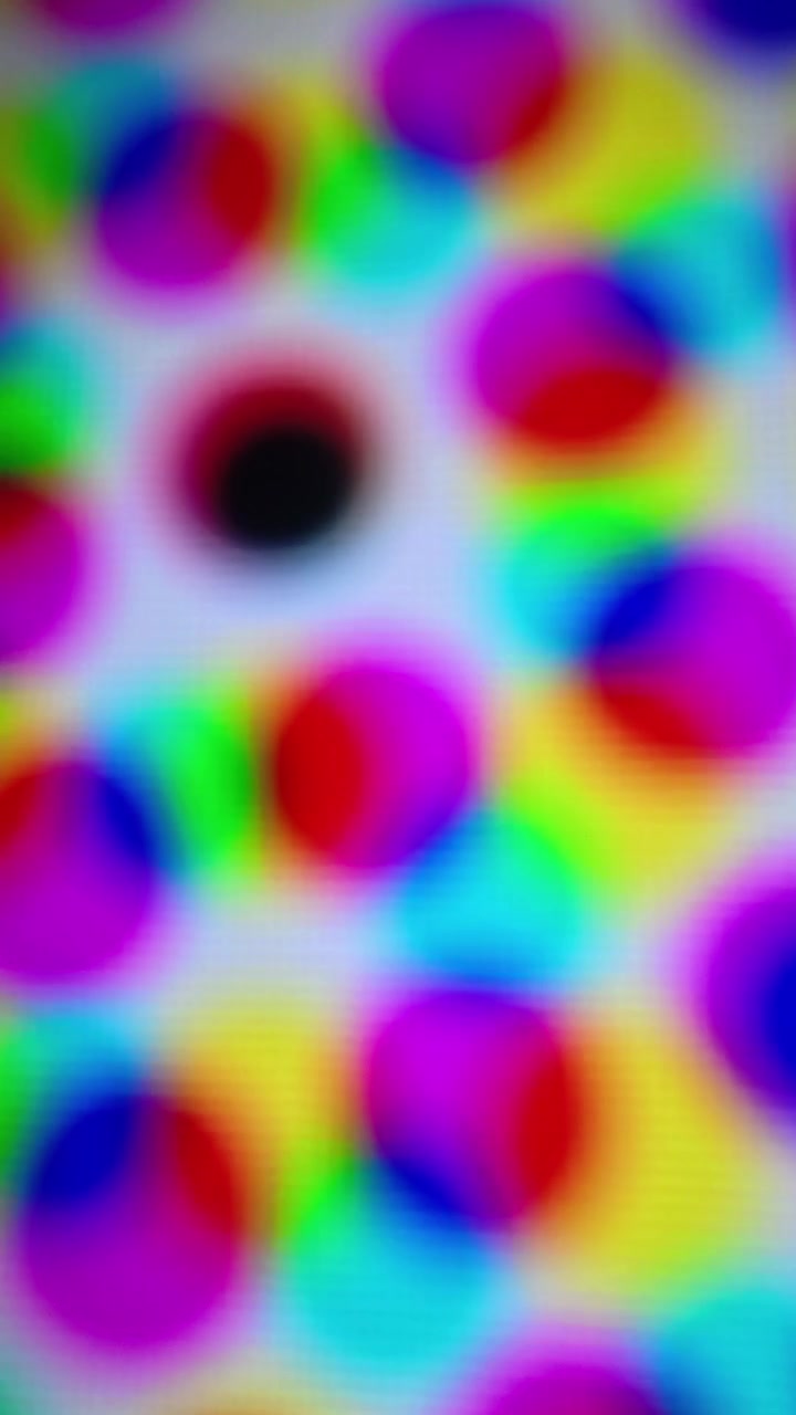 Sfondo animato astratto con pois colorati in movimento.
