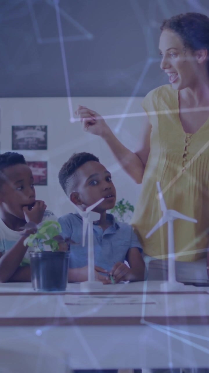 Animation of network of connections over happy diverse female teacher and pupils with wind turbines