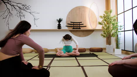 women doing yoga indoors