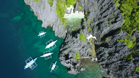 Panorama-Aerial-view:-the-Secret-Beach,-Shallow-tropical-lagoon-hidden-behind-karst-Rocks