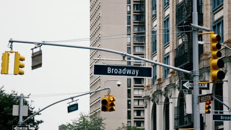 broadway street sign and traffic lights in new york city