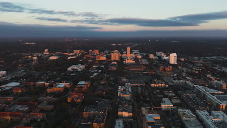 establishing drone shot toward the sunlit tallahassee city, evening in fl, usa