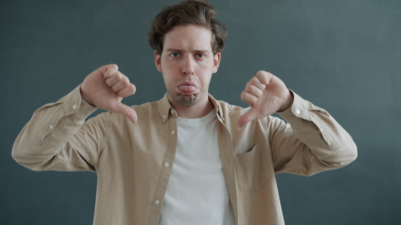 Man showing thumbs up and thumbs down