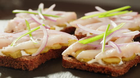 appetizing smoked fish sandwiches with red onion and dill