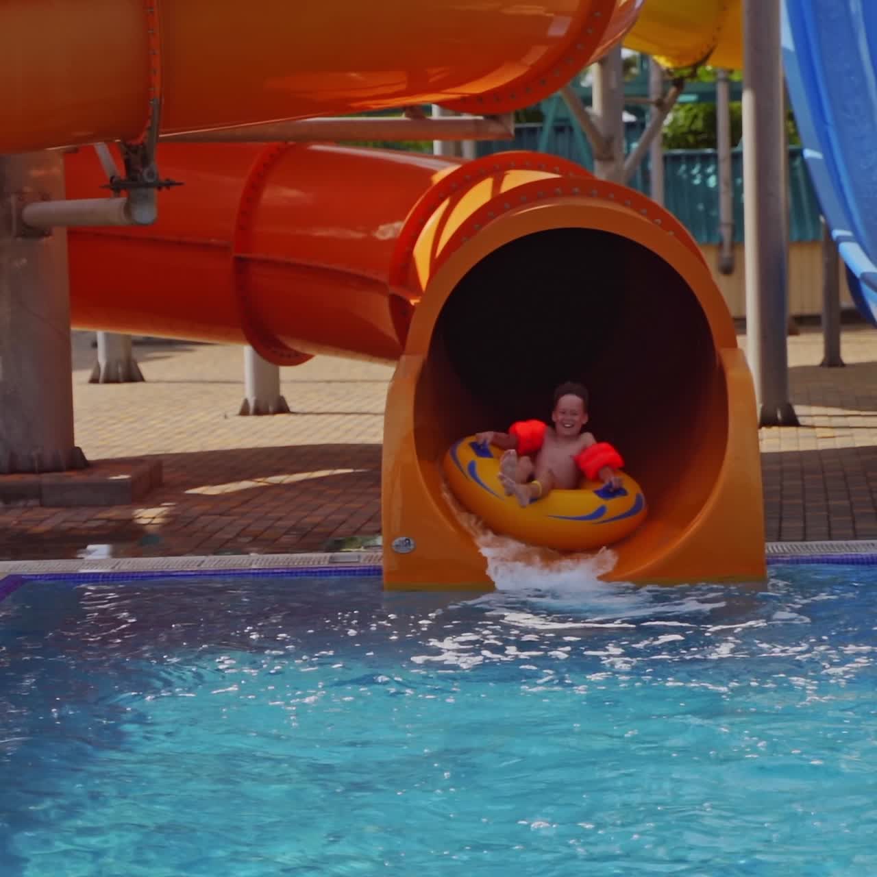 Sliding down on waterslide