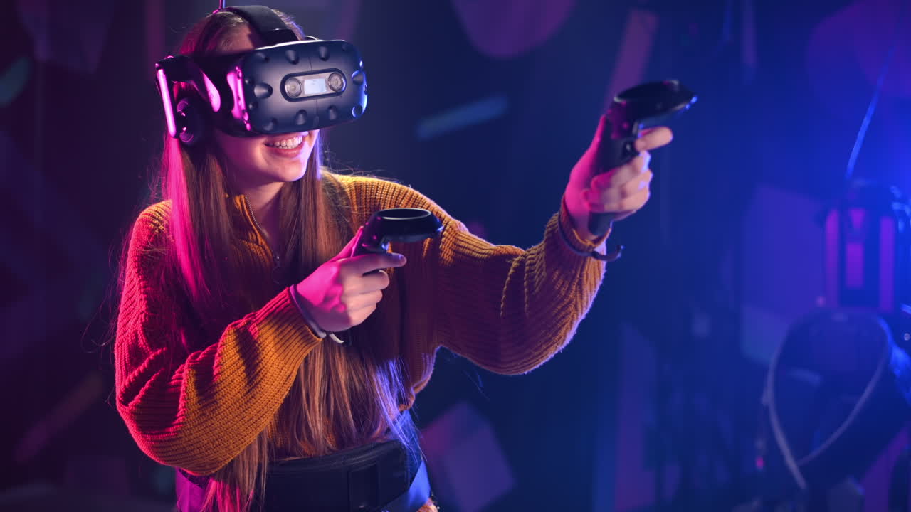 A joyful, interested girl is playing on VR treadmill with helmet, controllers and a backpack
