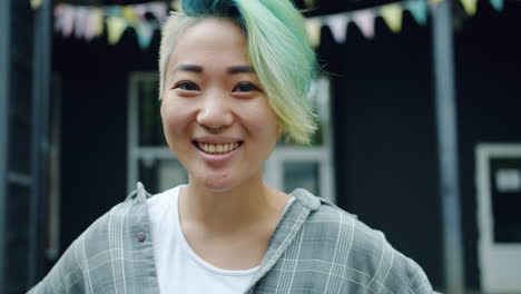 smiling young woman with colorful hair