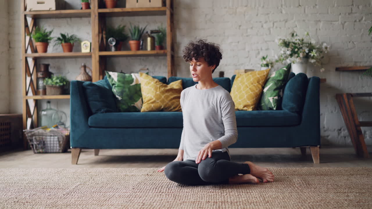 Woman Doing Yoga Stretches at Home