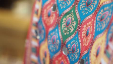 close-up of a colorful indian fabric with mirrors