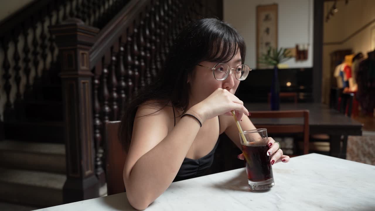 Young attractive girl, delicious refreshing coke drink, cafe customers