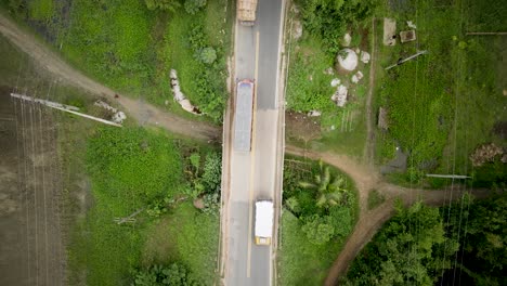 Areal-view-of-a-car-is-passing-on-a-bridge