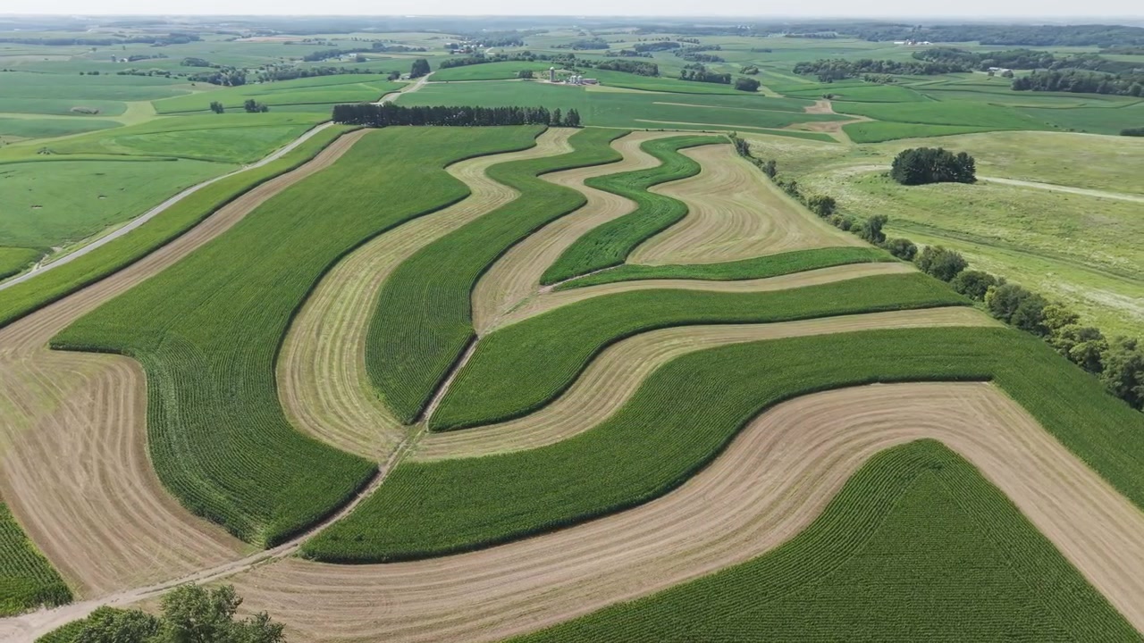 Contour Farming is a conservation practice that involves planting across a field’s slope, close to the contour as possible. This includes tilling and cultivation. Contour farming reduces soil erosion.