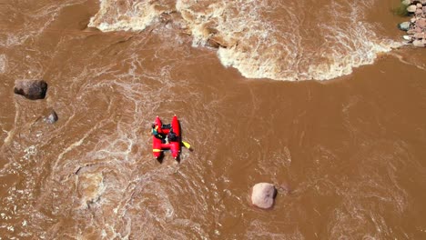 Aerial-View-Over-Red-Raft-Going-Through-Durango-Whitewater-Park-on-the-Animas-River-in-Colorado