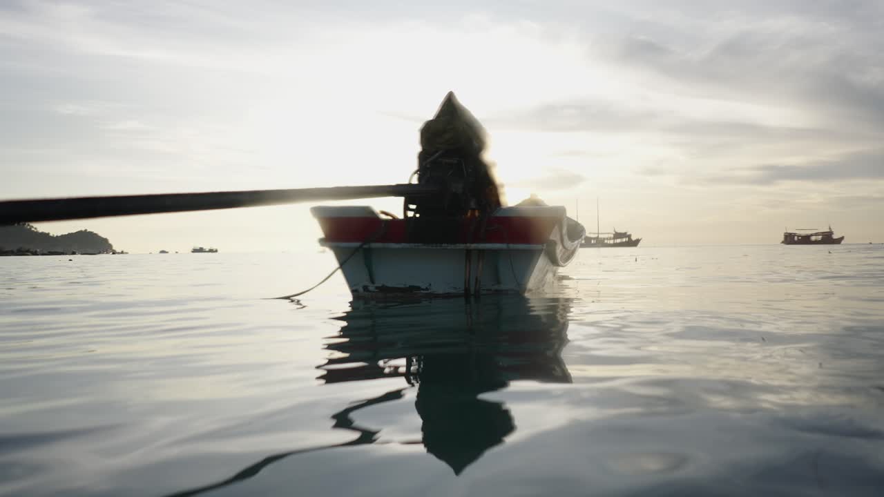 Small Boat on Serene Water at Sunrise or Sunset