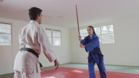 judokas training with a wooden saber