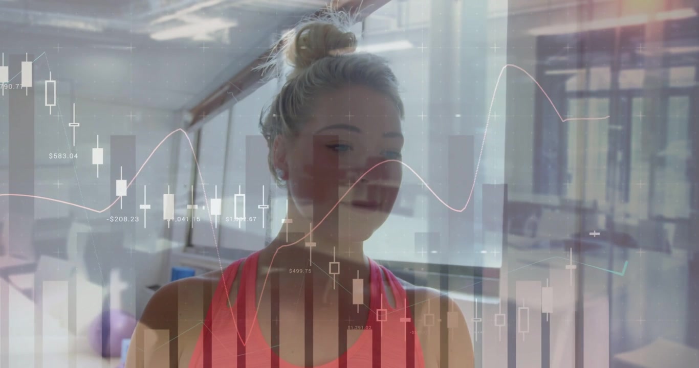 Woman in workout top observing animated financial charts appearing, turning head, blinking, smiling
