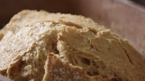 baking - sourdough bread fresh from the oven, slow motion close up