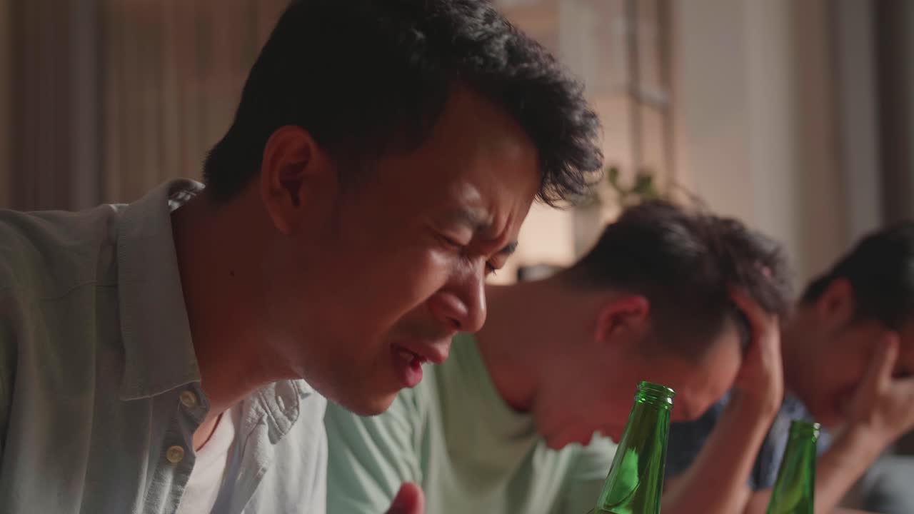 Friends watching a game, excited and anxious