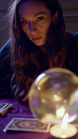 fortune teller with crystal ball and tarot cards