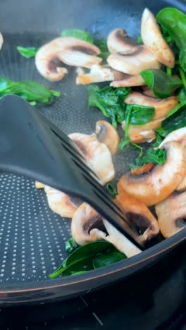 frying mushrooms and spinach