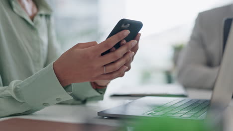 hands, using phone and typing on laptop