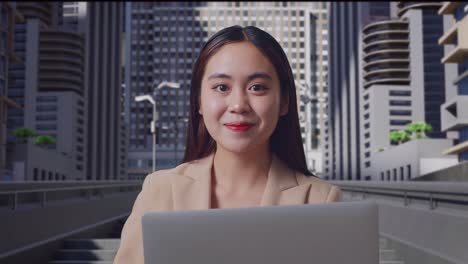 businesswoman working on laptop in city