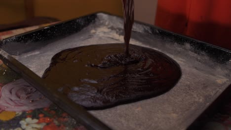 Real-time-pouring-dark-chocolate-mix-for-birthday-cake