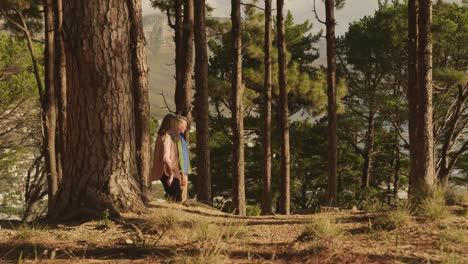 active senior couple walking in forest