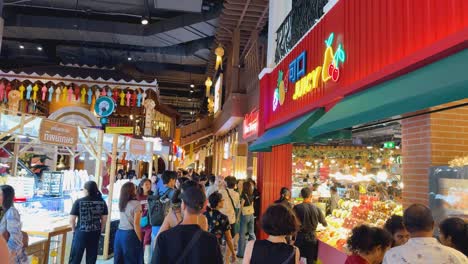 crowds explore vibrant market stalls and shops