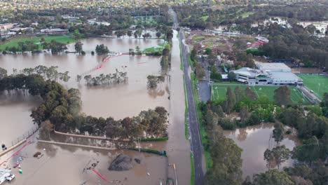 reversing drone footage of sporting field and yarra flats area in bulleen inundated with flood water on 14 october 2022