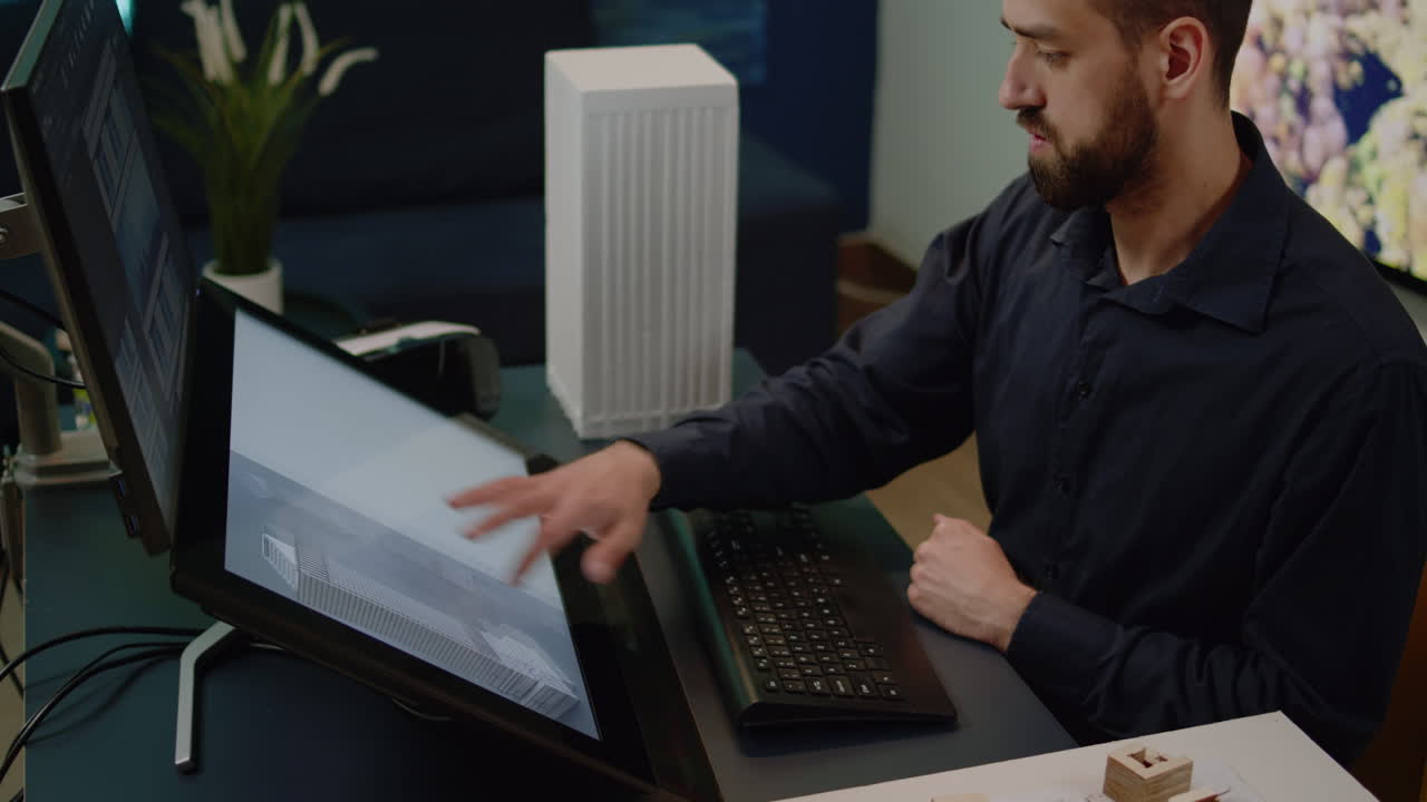 Close up of engineer using computer for building model