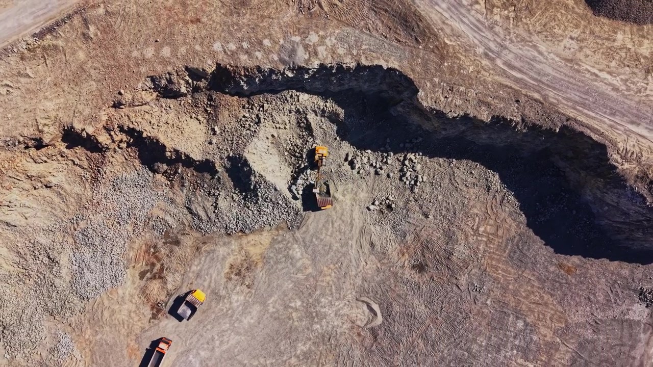 Construction site shows excavation work in progress with machinery