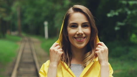 portrait of a beautiful woman in a yellow raincoat 1