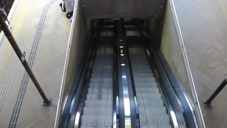 high-angle-view-of-a-empty-moving-escalator,-reaching-the-underground