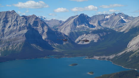 a thrilling helicopter tour of the canadian rocky mountains, breathtaking aerial views of snow-capped peaks, glaciers, rivers, and forests