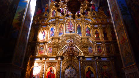 Chandelier-golden-decorations-and-paint-of-interior-baroque-church-cathedral,-Kiev-Pechersk-Lavra,-Kyiv-Ukraine