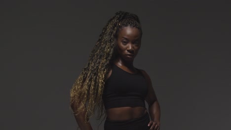 Studio-Portrait-Of-Young-Woman-Wearing-Gym-Fitness-Clothing-For-Exercise-1