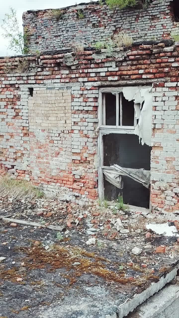 Ruins of abandoned old broken industrial factory. Vertical video