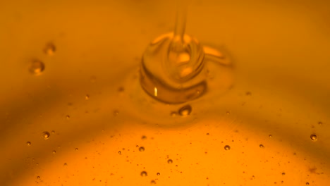 pouring honey. close-up of honey dripping