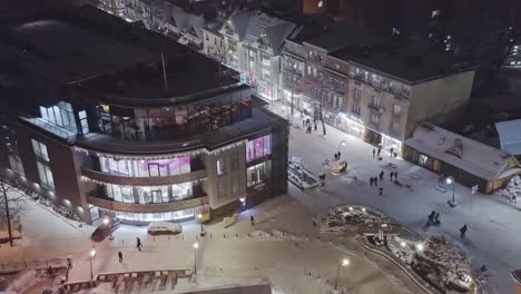 Aerial-night-winter-scene-of-people-walking-in-streets-of-Zakopane-Krupowki-district