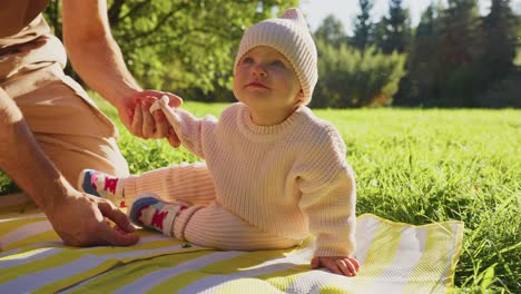 father and baby in park