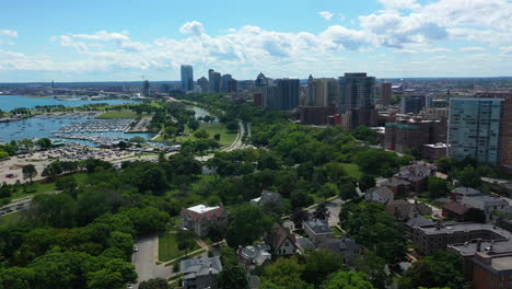 drone shot over the back bay park and the n lincoln memorial dr in sunny milwaukee, usa